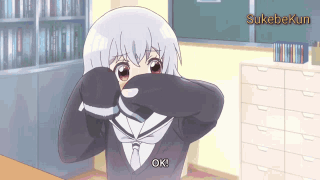a girl with white hair and red eyes is covering her face with her hands and the word ok is above her