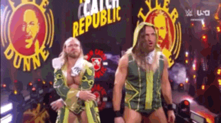 a couple of men are standing next to each other in front of a sign that says republic .