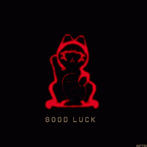 a green cat with the words `` good luck '' below it