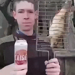 a man holding a can of raise juice