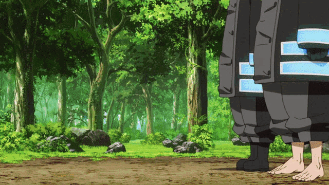 a man in a black jacket with the letter e on the back stands in a forest