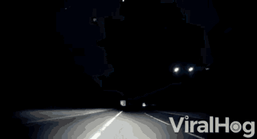 a video of a car driving down a highway at night with the words viralhog on the bottom