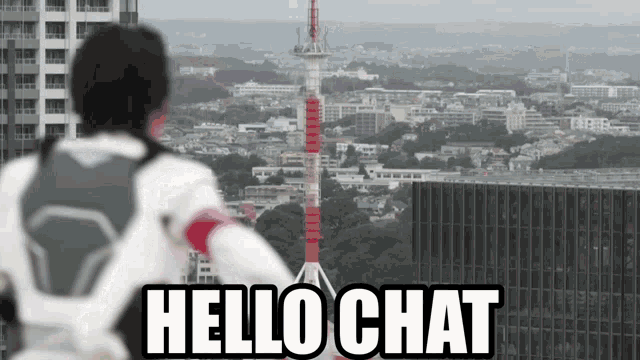 a man standing on top of a building looking out over a city with the words hello chat above him