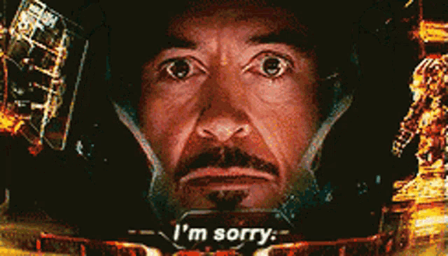 a close up of a man 's face with the words i 'm sorry on it