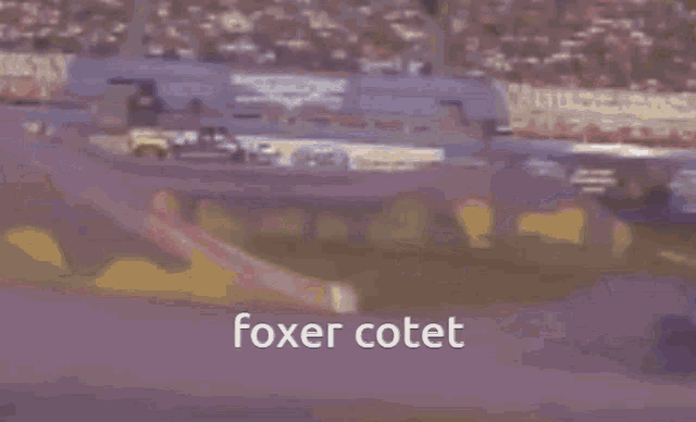 a monster truck that says foxer cotet is driving on a dirt track