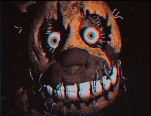 a close up of a skeleton with sharp teeth looking at the camera