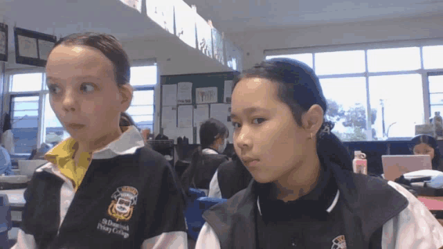 two girls wearing uniforms for o'brien's primary college