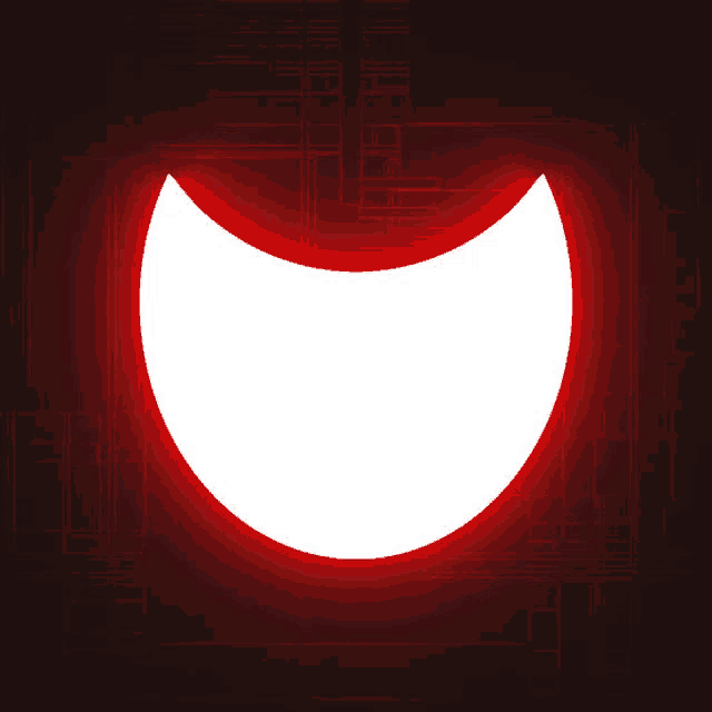 a white circle with a red border is glowing in the dark