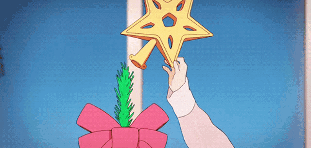 a little girl is reaching up towards a star on top of a christmas tree