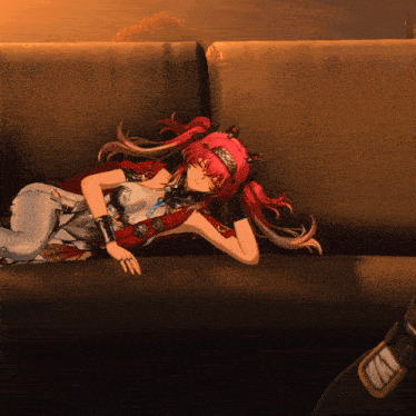 a red haired anime girl is laying on a couch