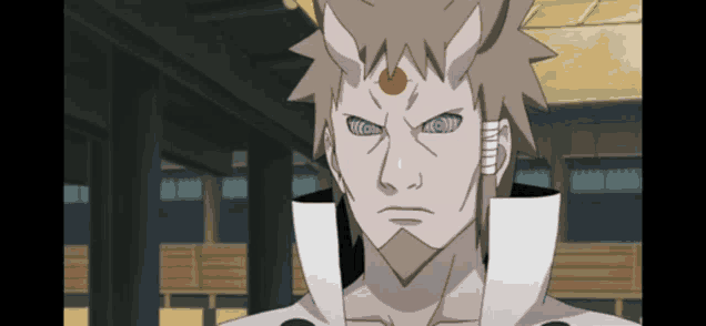 a cartoon character with purple eyes and a red center on his forehead