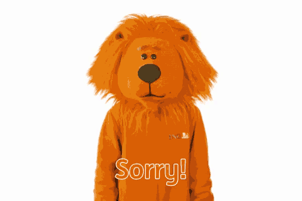 a stuffed lion with the word sorry on the bottom