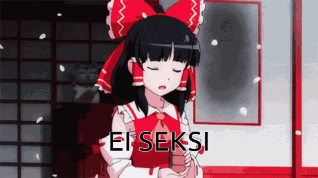a girl with a red bow on her head is holding something in her hand and the word ei seksi is on the bottom