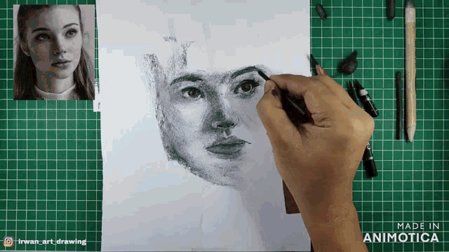 a person is drawing a woman 's face on a green cutting board