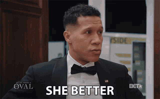 a man in a tuxedo says " she better "