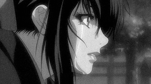 a black and white photo of a crying anime girl with tears running down her face .