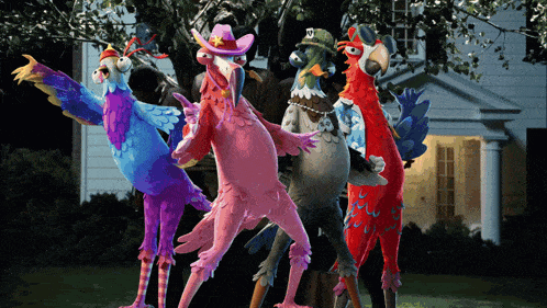 a group of cartoon birds are standing in front of a house
