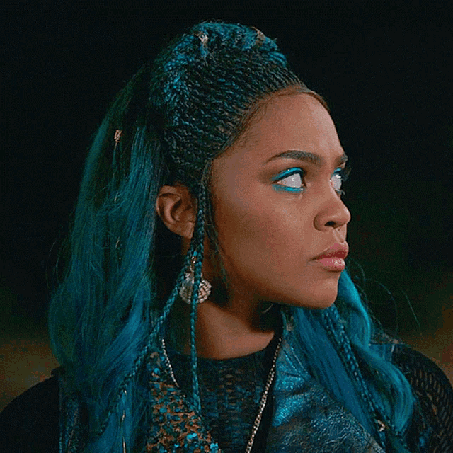 a close up of a woman with blue hair wearing a hat