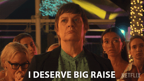 a woman says i deserve big raise in front of a group of women