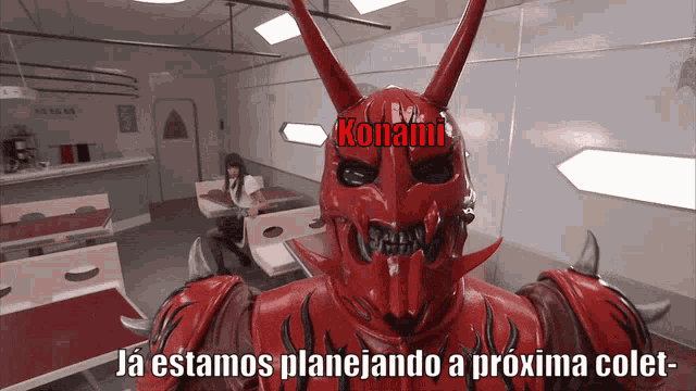 a red monster with horns and the word konami on his head