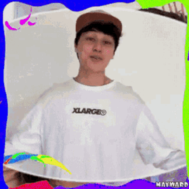 a man wearing a white shirt that says xlarge genuine love