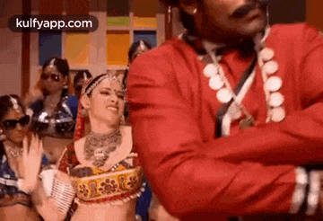 a man and a woman are dancing together in a room .