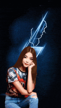 a girl in a tie dye shirt is posing for a picture with a lightning bolt in the background