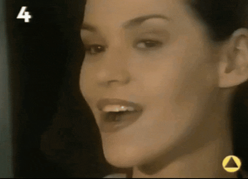 a close up of a woman 's face with the number 4 on the bottom