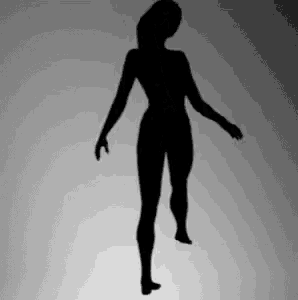 a silhouette of a woman is standing on a gray background