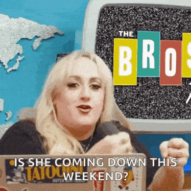 a woman is talking into a microphone with the words " is she coming down this weekend " behind her