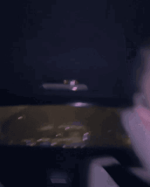 a blurry picture of a man 's face with his eyes closed .