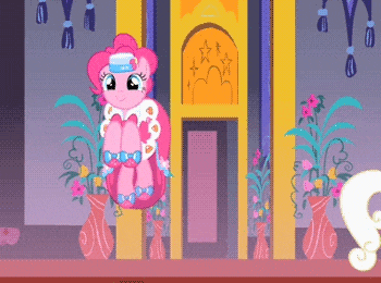 pinkie pie is standing in front of a building
