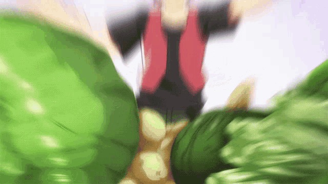 a blurry picture of a person in a red and black outfit