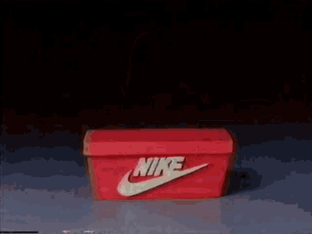 a cartoon character is standing next to a boombox with his arms outstretched .