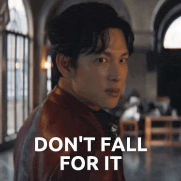 a man in a leather jacket says " do n't fall for it " in front of him