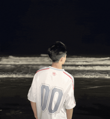 a man wearing a white shirt with the number 00 on the back