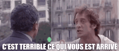 two men are talking to each other in front of a building with the words `` c est terrible ce qui vous est arrivé '' .