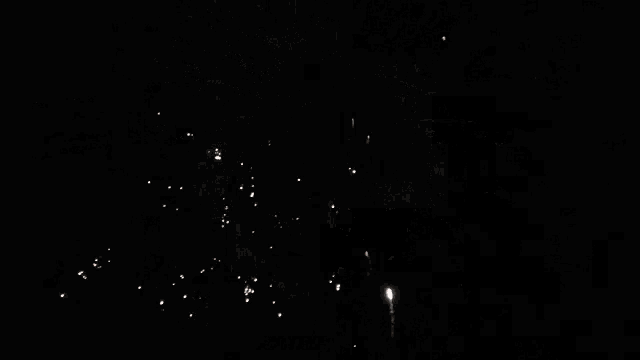 a fireworks display with a pepsi logo in the center