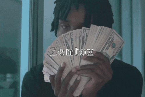 a man holding a stack of money with the word zentox on the bottom right