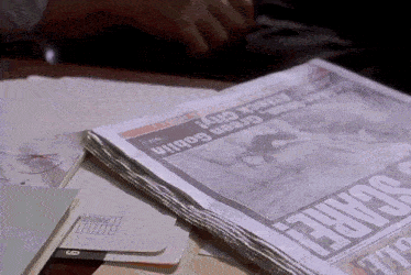 a stack of newspapers including one that says scare