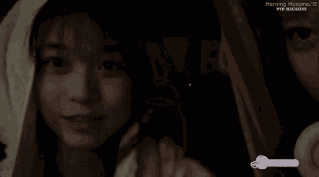 a close up of a person 's face with the words morning musume written on the bottom