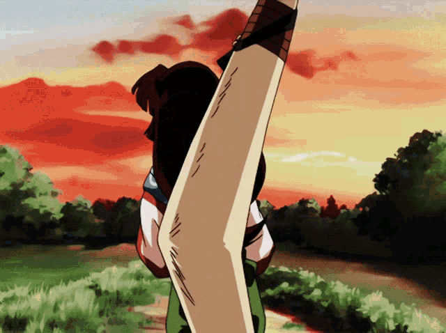 a cartoon character holding a large sword in front of a sunset