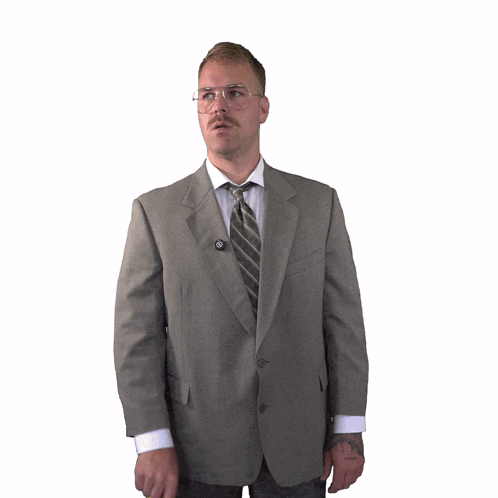a man in a suit and tie is holding a yellow piece of paper with the letter o drawn on it