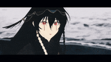 a girl with long black hair and red eyes is standing on a beach .