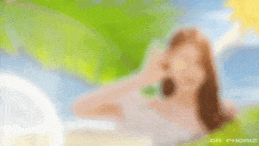 a woman is holding a potato in front of her eye .