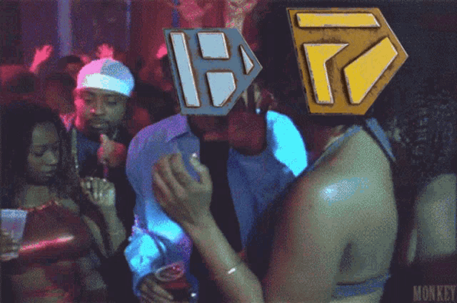 a group of people at a party with monkey written on the bottom right corner