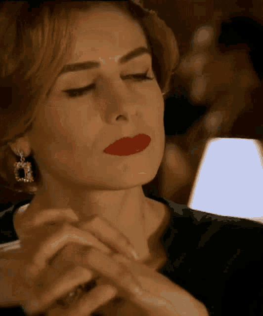 a close up of a woman 's face with red lips