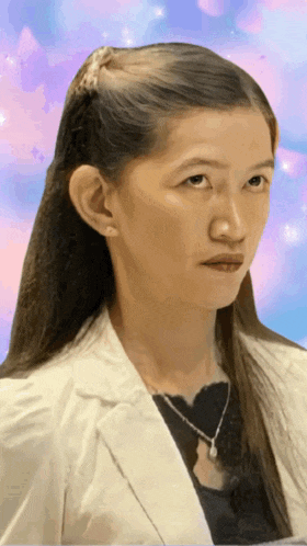 a woman with long hair is wearing a white jacket and a black shirt