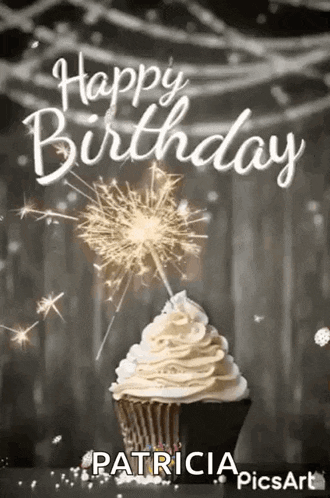 a happy birthday greeting card with a cupcake and sparklers