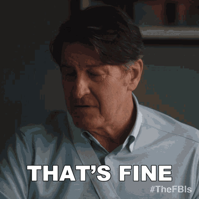 a man in a blue shirt says that 's fine on a screen